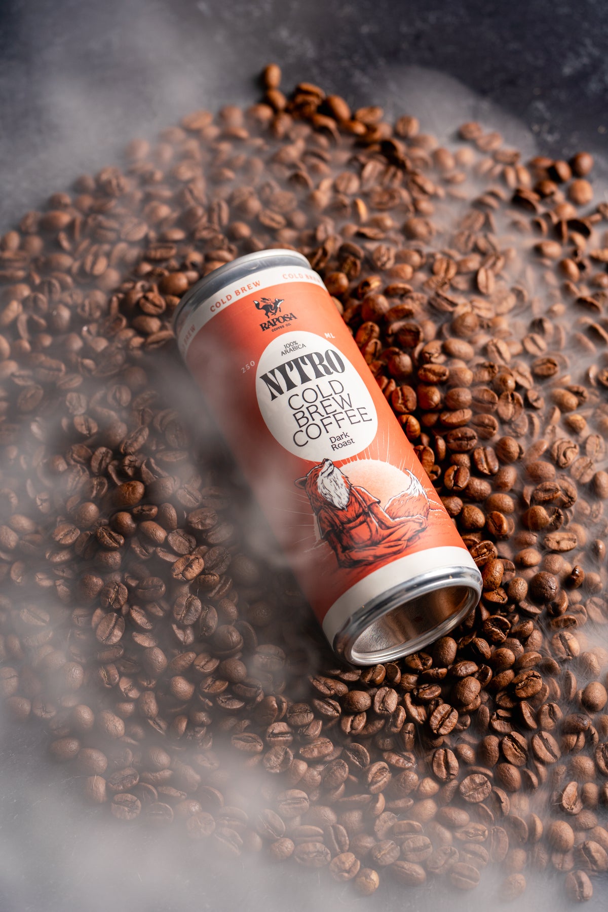 raposa nitro cold brew coffee laying in freshly roasted whole beans