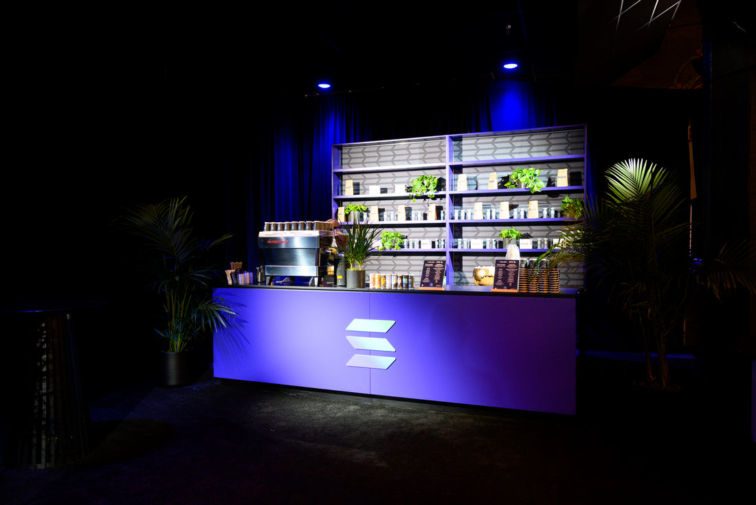 raposa Modern bar counter with shelves stocked with nitro cold brew at a corporate event