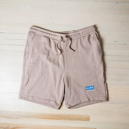 Kups by Raposa Coffee tan fleece shorts flat lay with embroidered logo