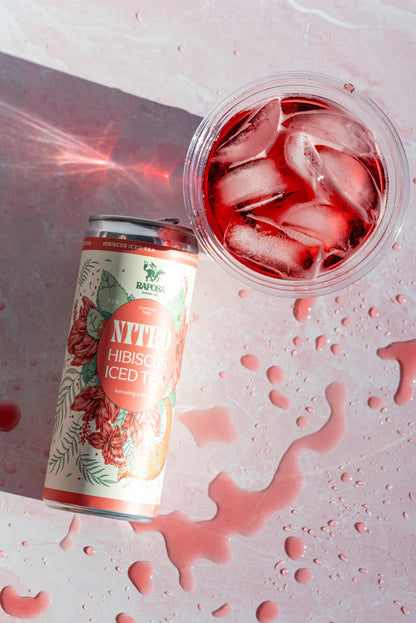 Raposa Hibiscus Iced Tea can on pink background