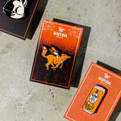 raposa metal enamel pins displayed in branded packaging