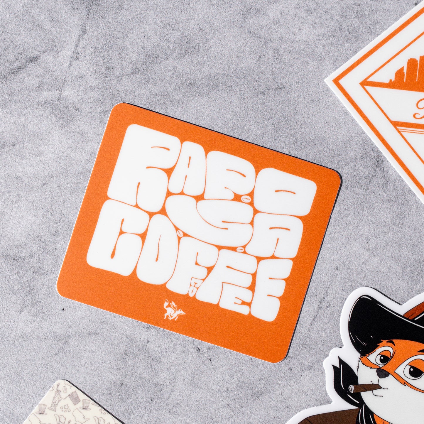 Orange and white vinyl sticker with 'Raposa Coffee' text