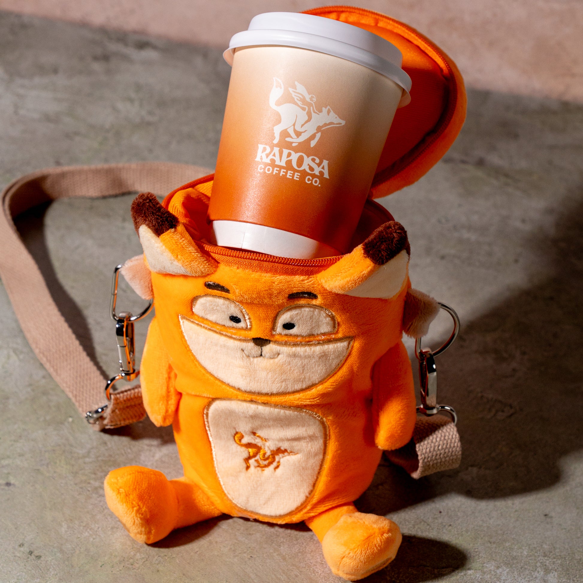 reusable plush coffee cup holder holding hot drink, insulated sleeve