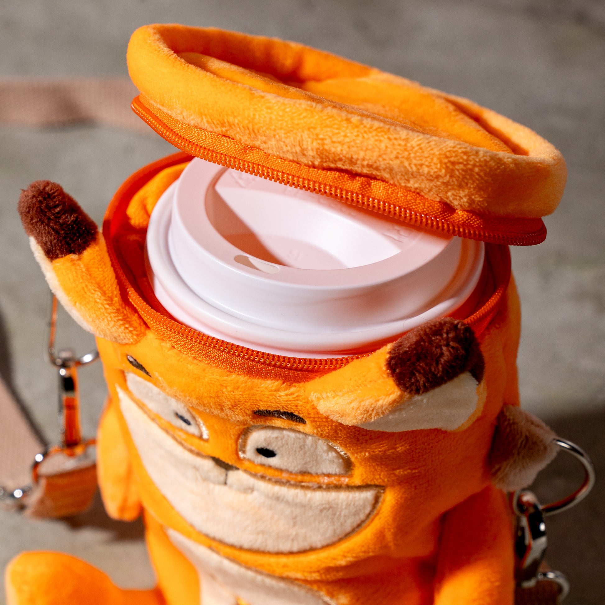 raposa fox plush cup holder showing zip-top opening and cup fit