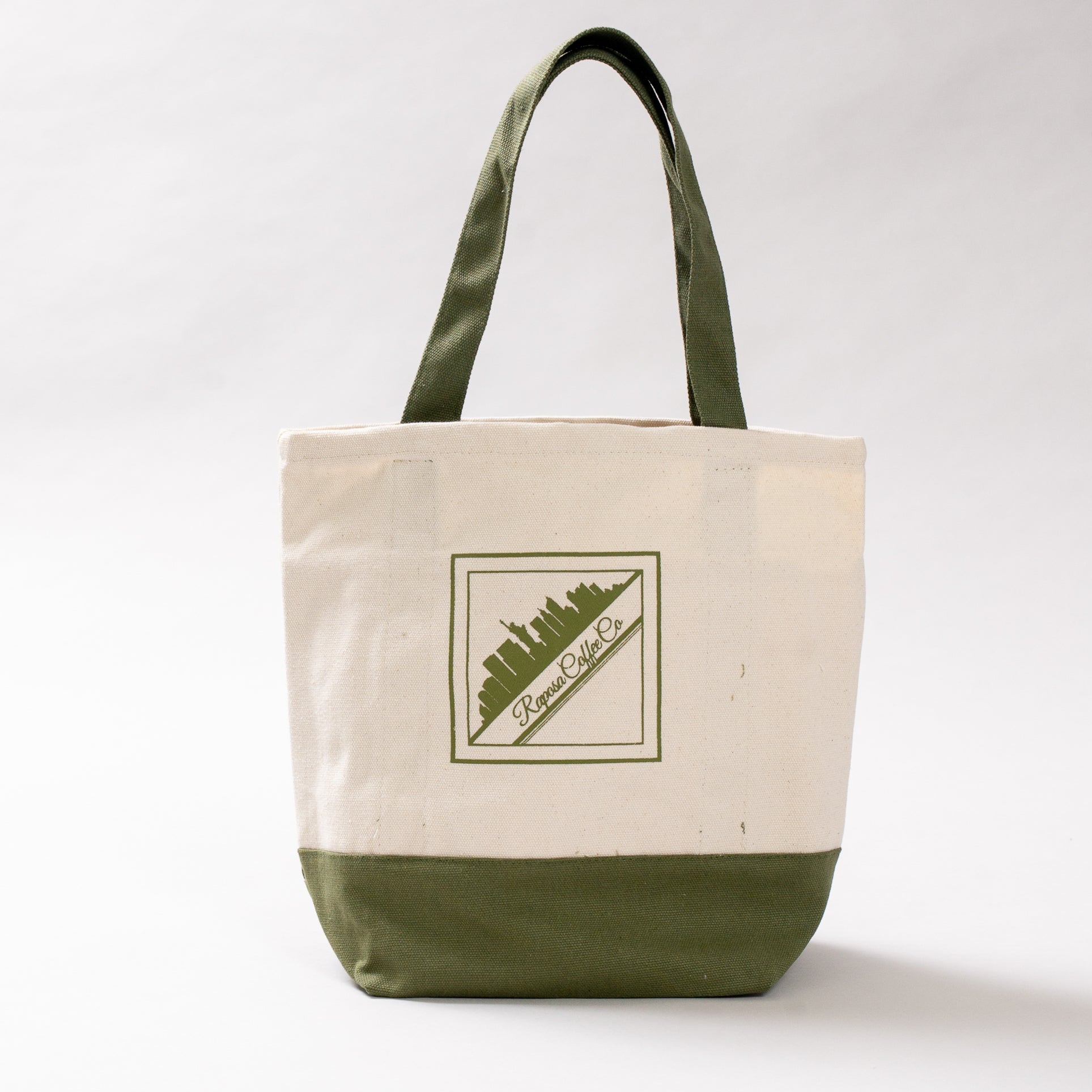 raposa new york canvas tote bag with olive green handles and cityscape logo, front view