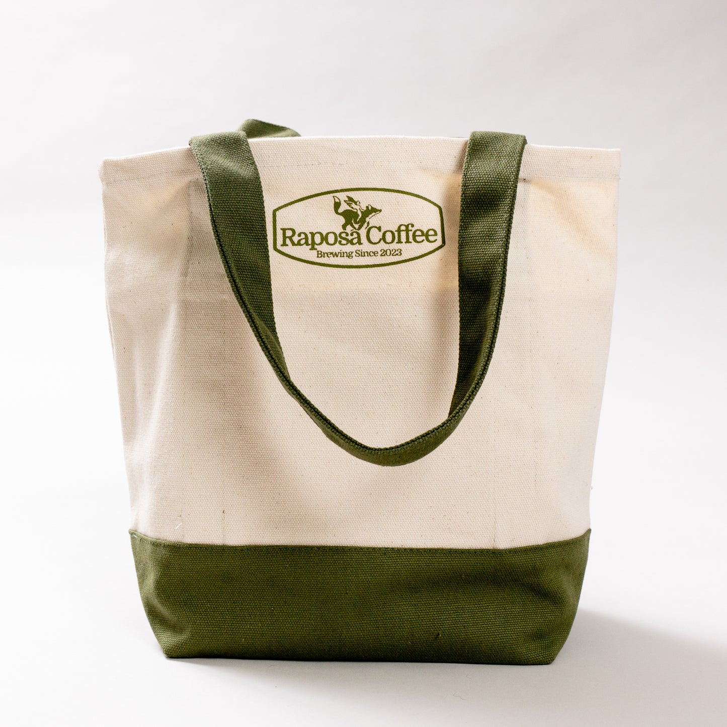raposa canvas tote bag side view showing olive green handles and reinforced base
