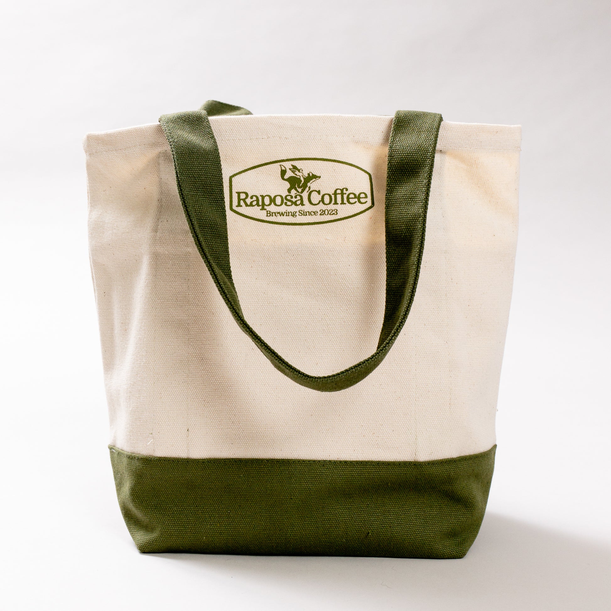 raposa canvas tote bag side view showing olive green handles and reinforced base