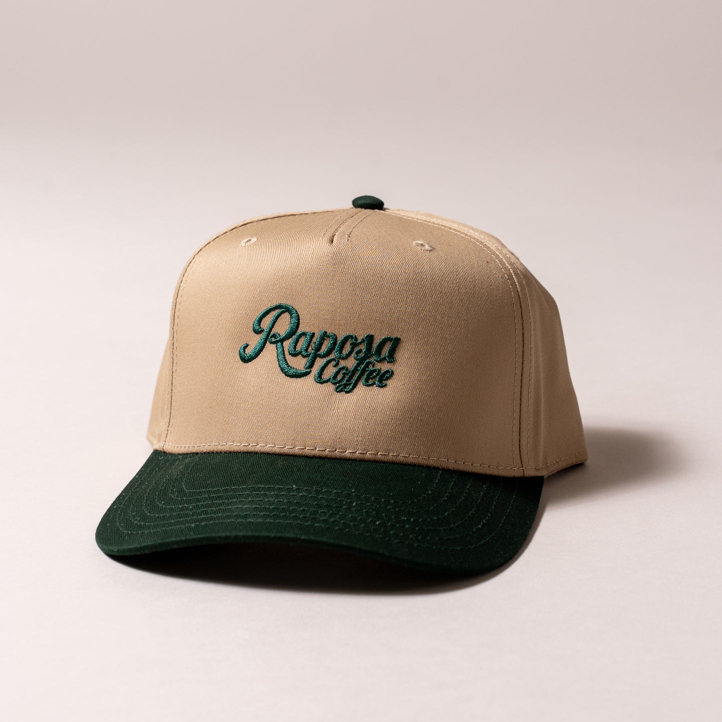 raposa coffee tan and green snapback hat, front view