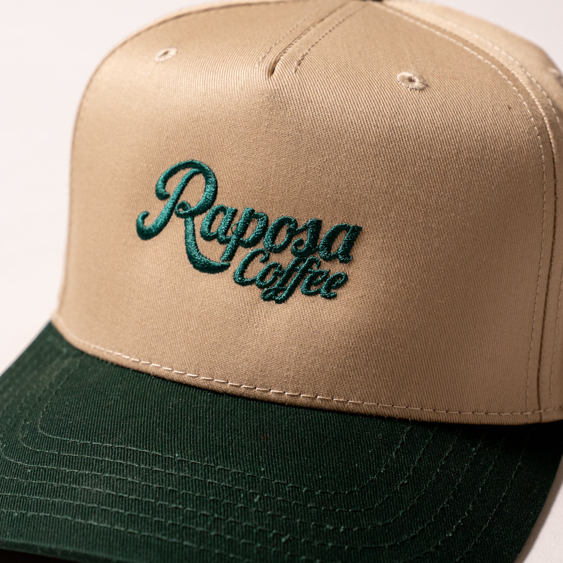 raposa coffee embroidered logo snapback cap, angled front view