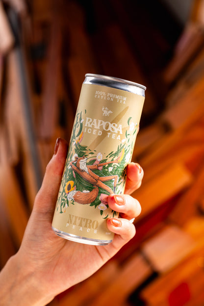 raposa peach iced tea held by a hand