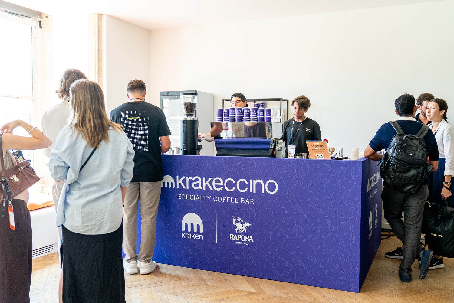 People waiting in line at a raposa custom kraken coffee bar 